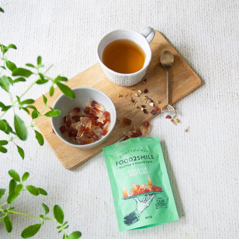 Veganske og sukkerfri cola-vingummier – bløde slikstykker med klassisk colasmag uden gluten, perfekt som en ansvarlig snack med masser af smag.