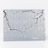 Eksklusiv Summerbird julekalender med klassiske og sæsonbestemte chokolader i elegant sølvdesign.