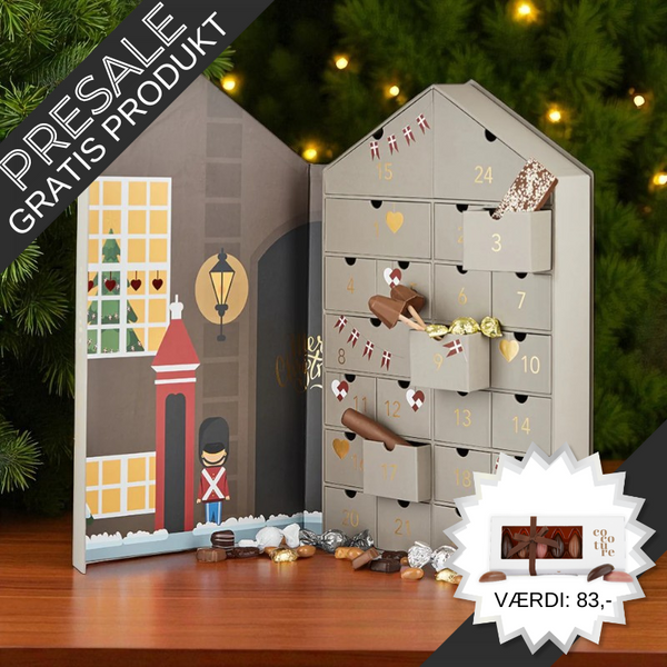 Fortryllende julehus-julekalender med 24 skuffer fyldt med chokolade, lakrids, marcipan og andre søde overraskelser – perfekt til par eller små familier.	