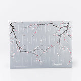 Eksklusiv Summerbird julekalender, der kombinerer mørk og Amber chokolade i fyldte varianter og sæsonfavoritter.