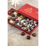 Åben chokoladegave fra Xocolatl med fyldte chokolader og dragéer